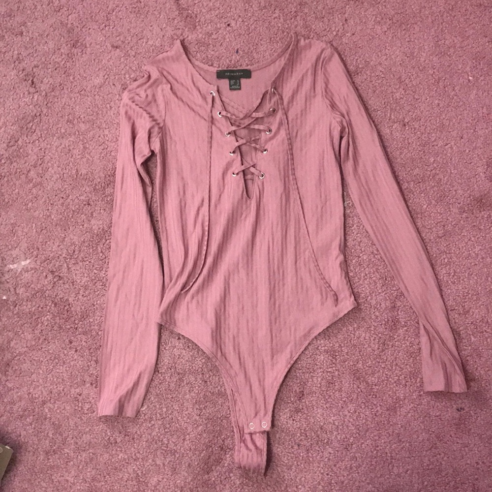 Pink lace up bodysuit.